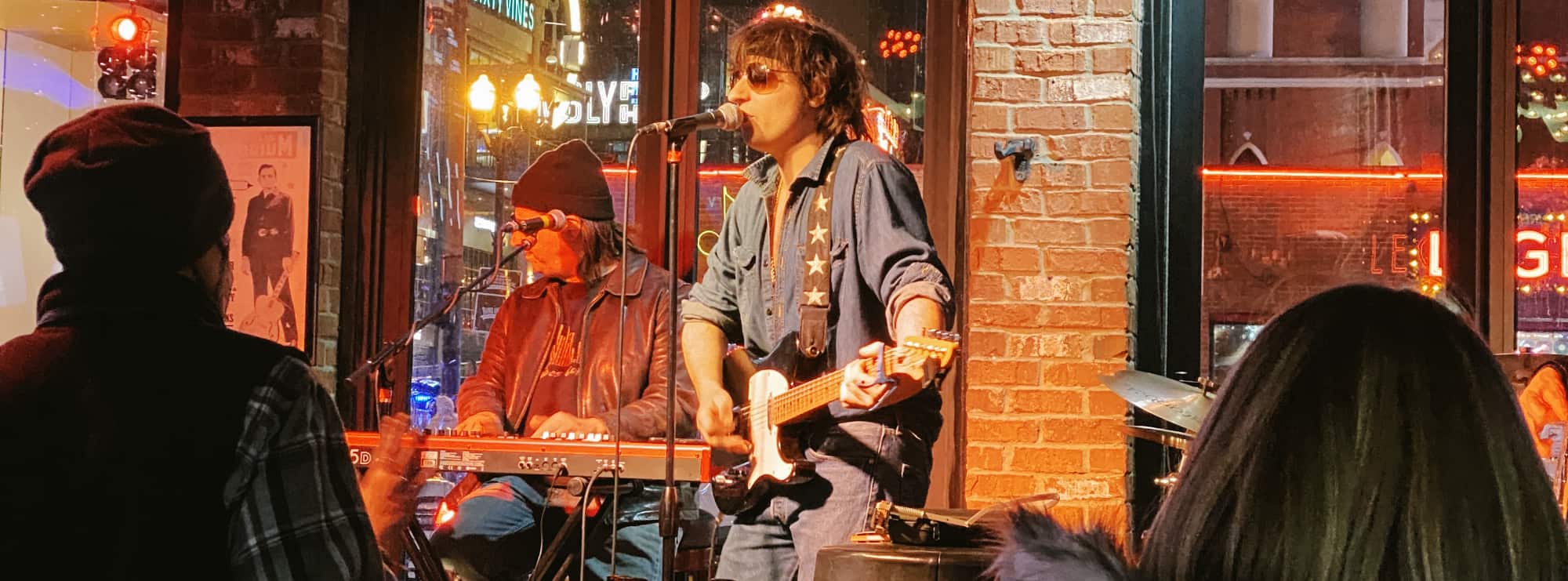 bar singer on guitar in Houston